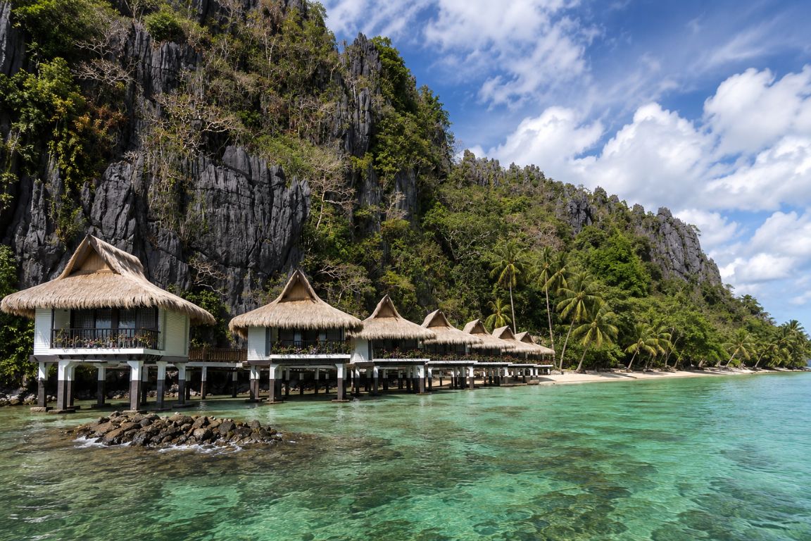 Beautiful Miniloc Island Resort surrounded by limestone cliffs and turquoise water during an El Nido Tours adventure