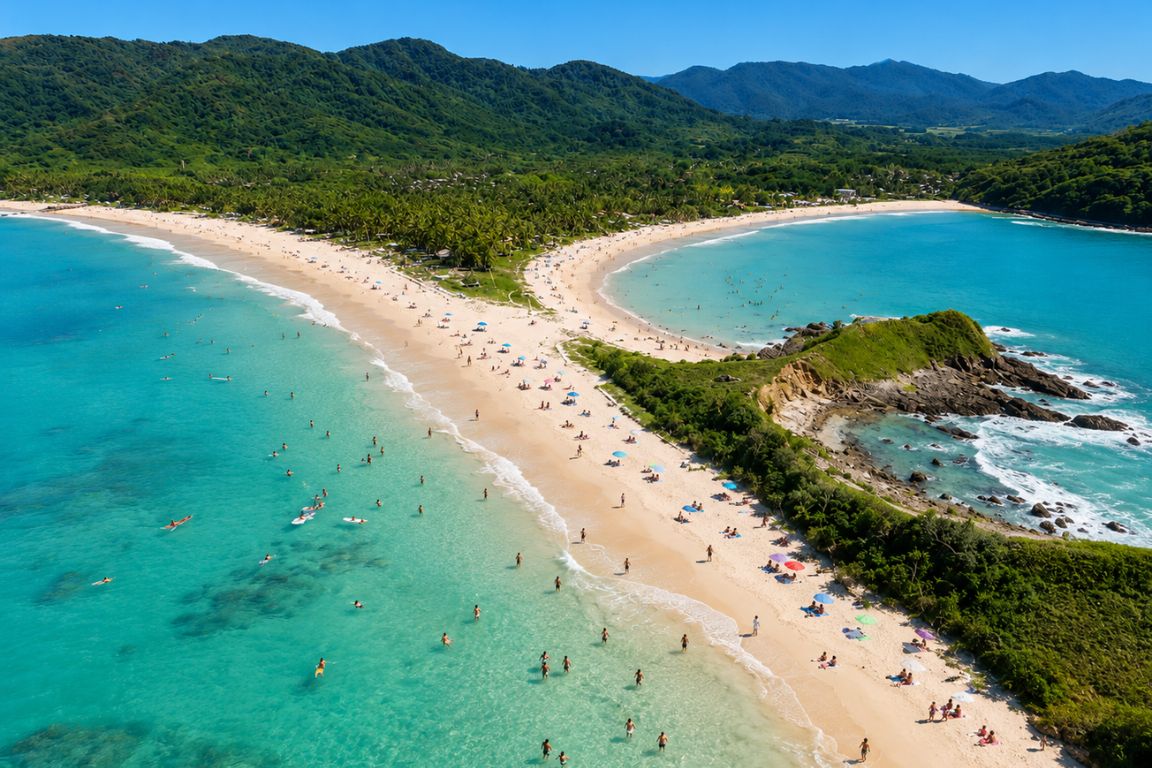 Crowded tropical shoreline at Nacpan Beach during an El Nido island hopping tour with El Nido Tours