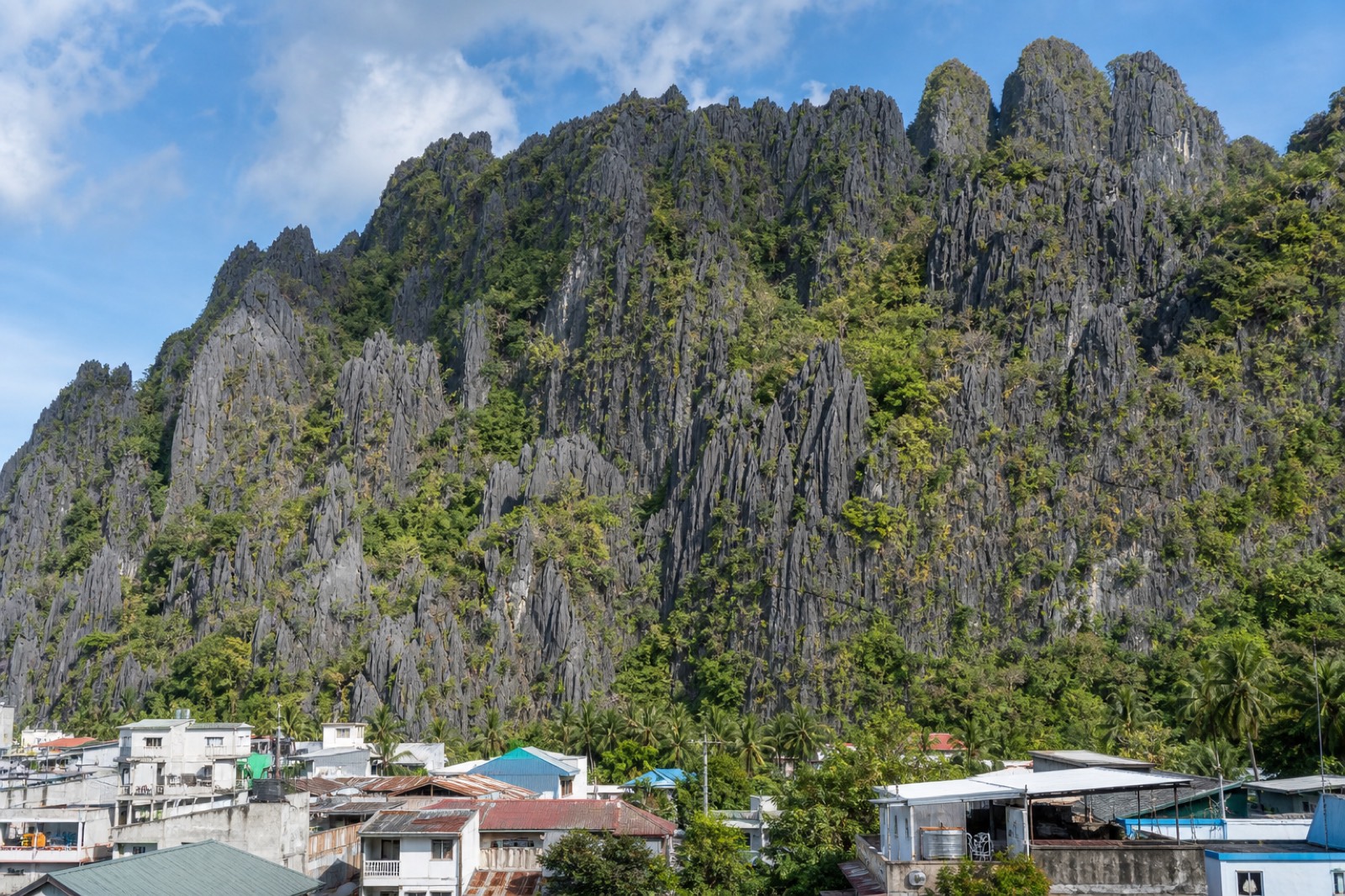 View over El Nido town and Bacuit Bay from the limestone ledges of Taraw Cliff at first light