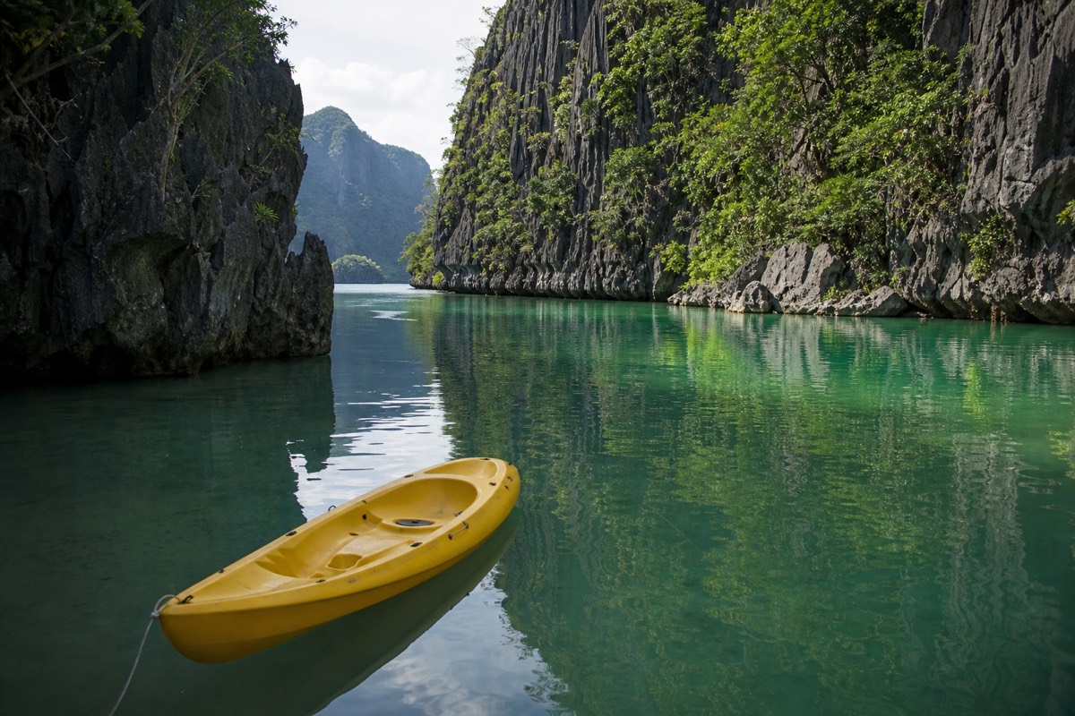 Kayaking into the Big Lagoon between the karst walls