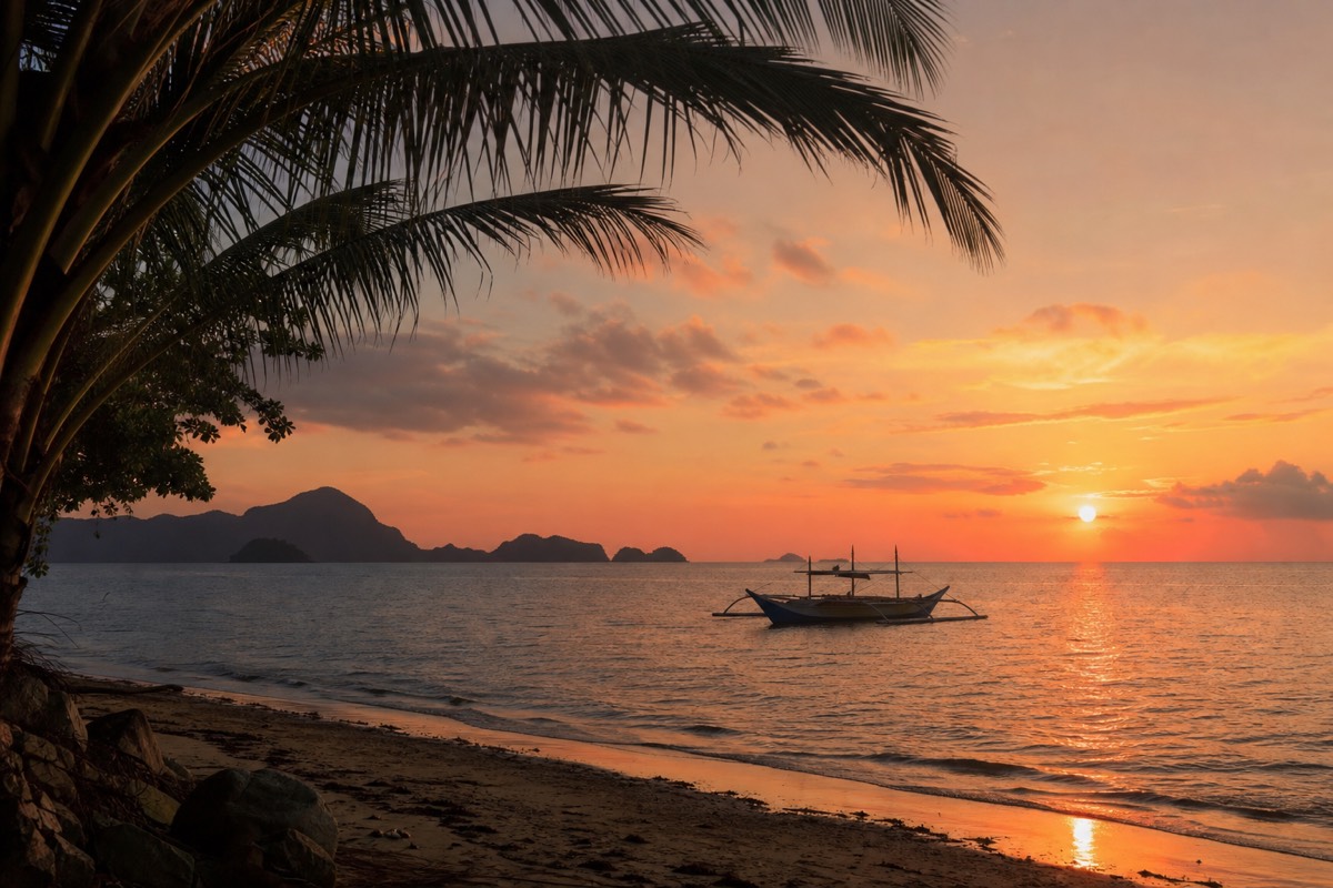 Sunset over Las Cabanas Beach near El Nido town